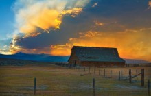 Barn and Distant Forest Fire at Sunset - Montana